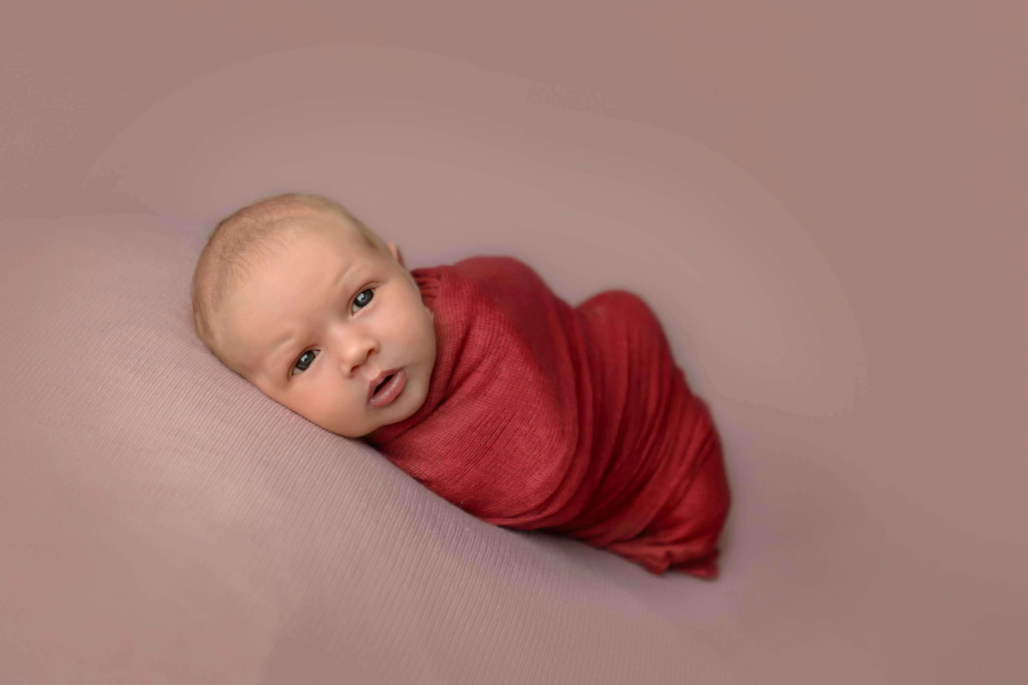Adorable awake newborn portrait.