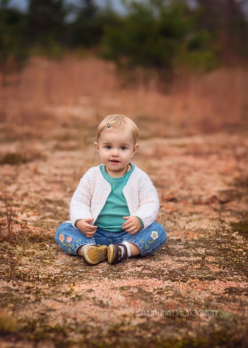 A photo of a toddler sitting down.