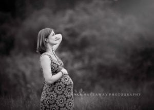 A beautiful black and white image of an expecting mom.