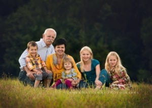 An image of a group of children with their grandparents.