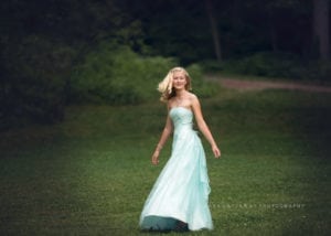A shot of a nicely dress up tween twirling.