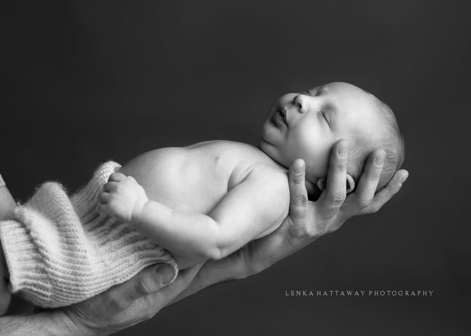 A black and white image of a newborn.