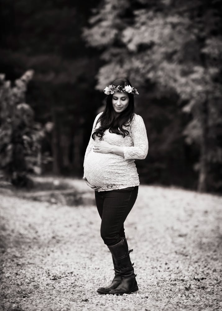 A black and white portrait of a pregnant woman.