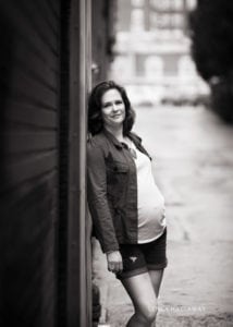 A black and white photo from a maternity urban session.