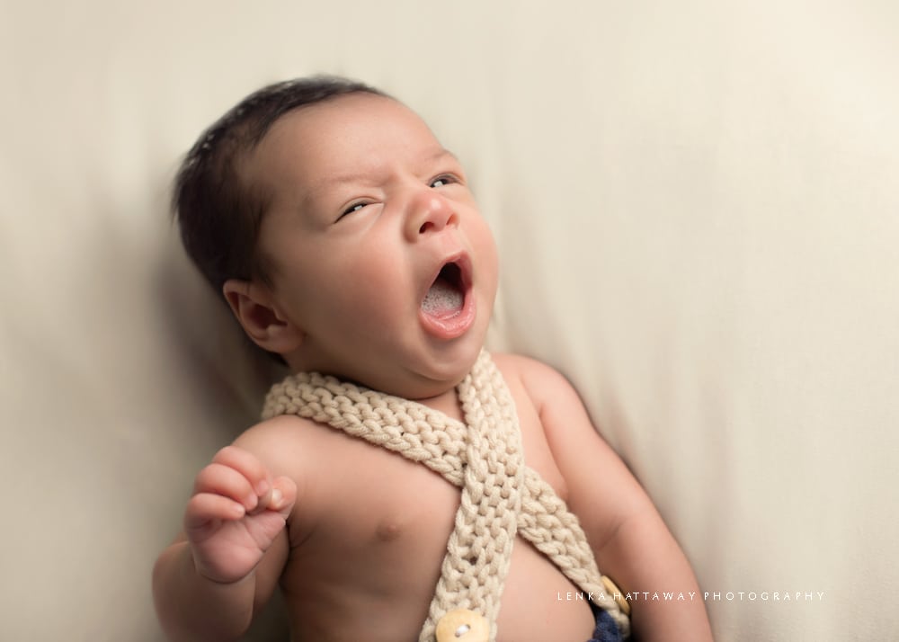 Sweet photo of a yawning newborn.