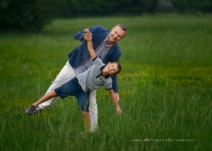 Father and son being playful during their outdoor photo shoot.