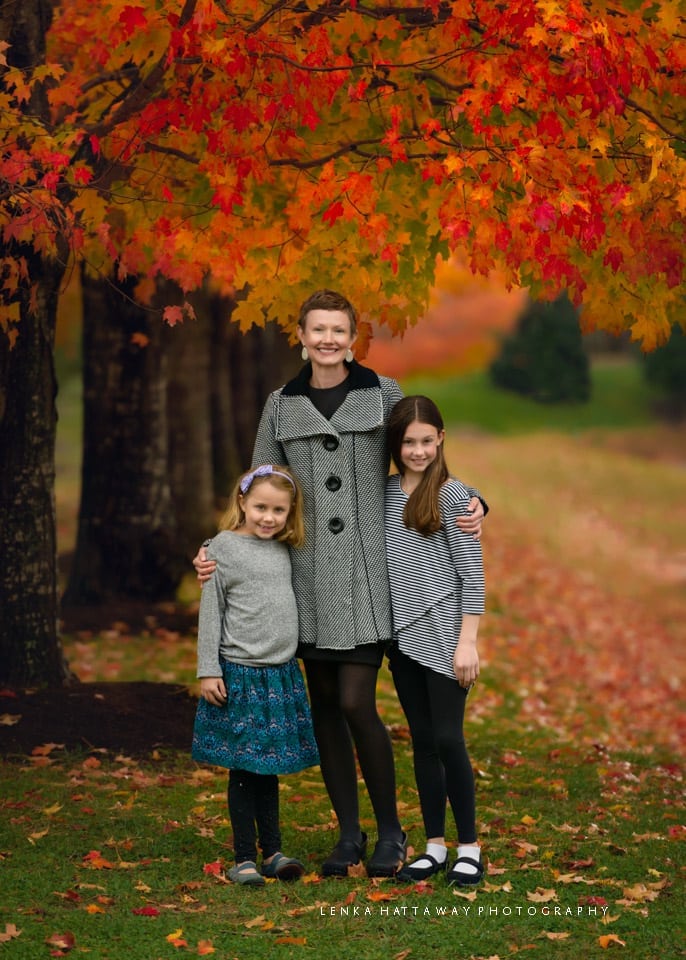 Beautiful fall colors surrounding mom and her two girls.