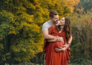 Fall maternity photo of a couple at the Biltmore Estate, Asheville.