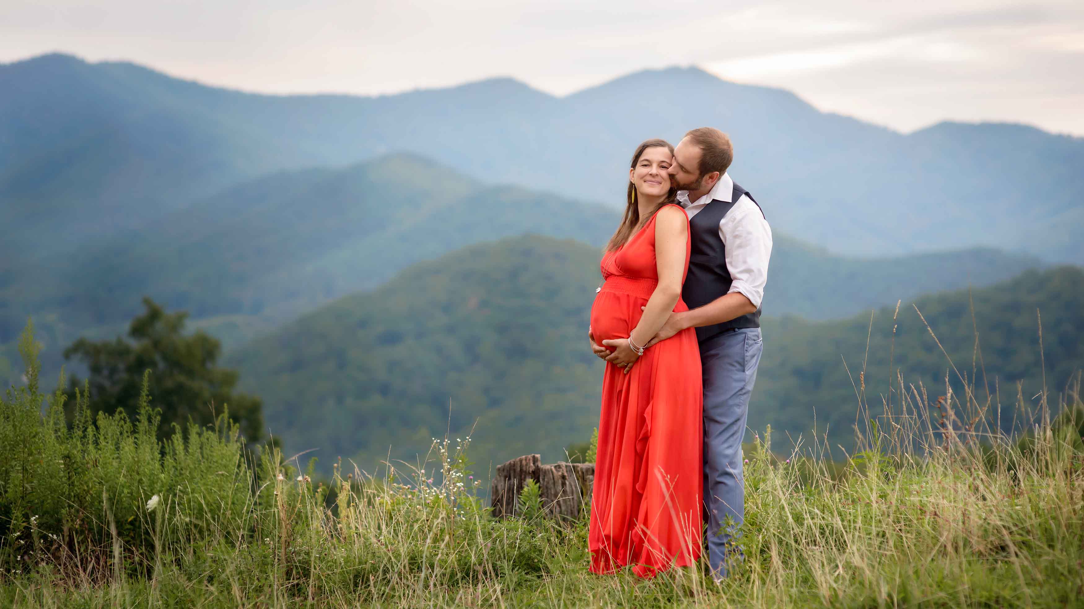 Maternity photography in Asheville with mountains in the background.