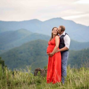 Maternity photography in Asheville with mountains in the background.