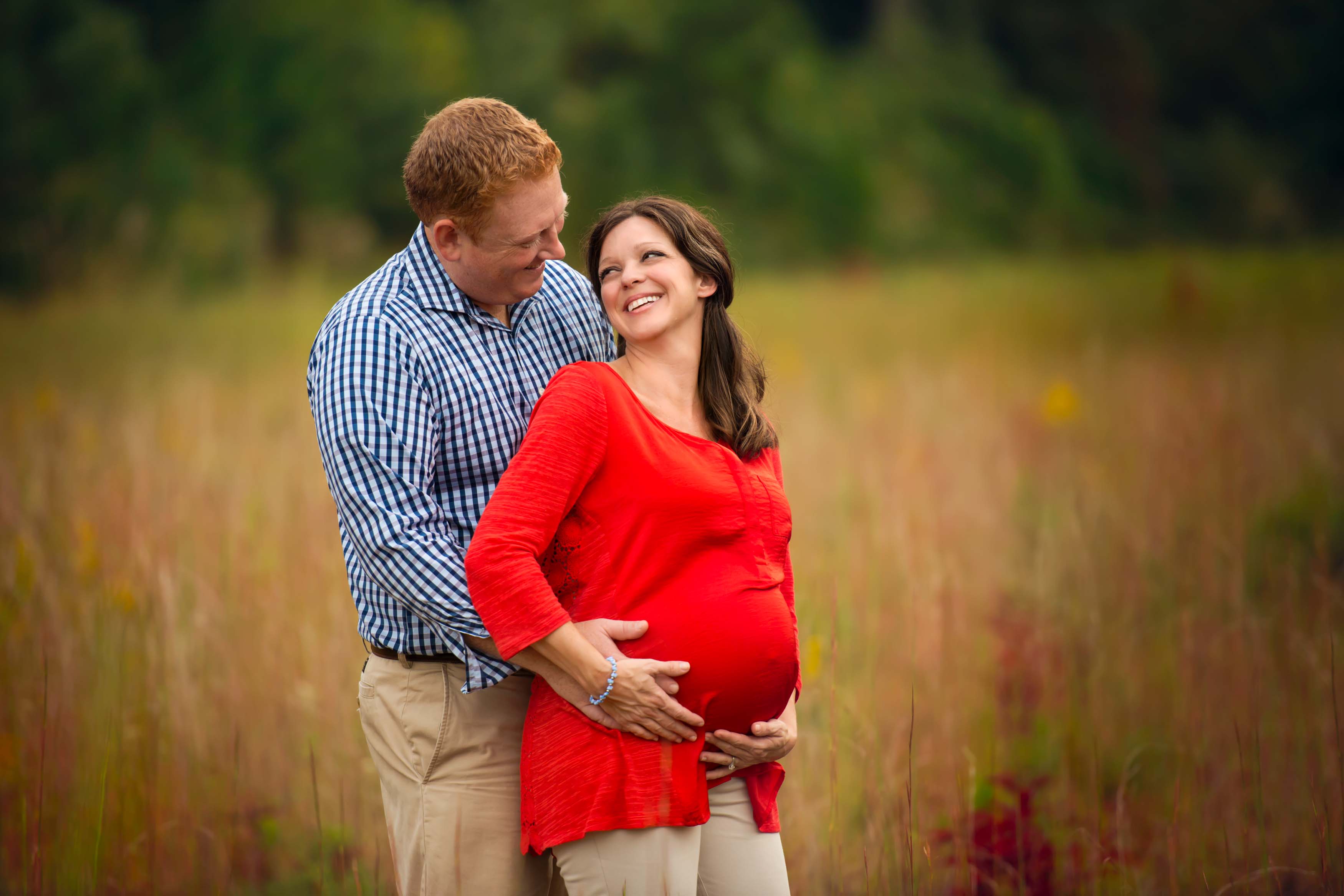 Couple together during a maternity photography session.