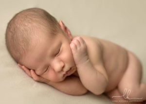 Natural sleeping newborn portrait.