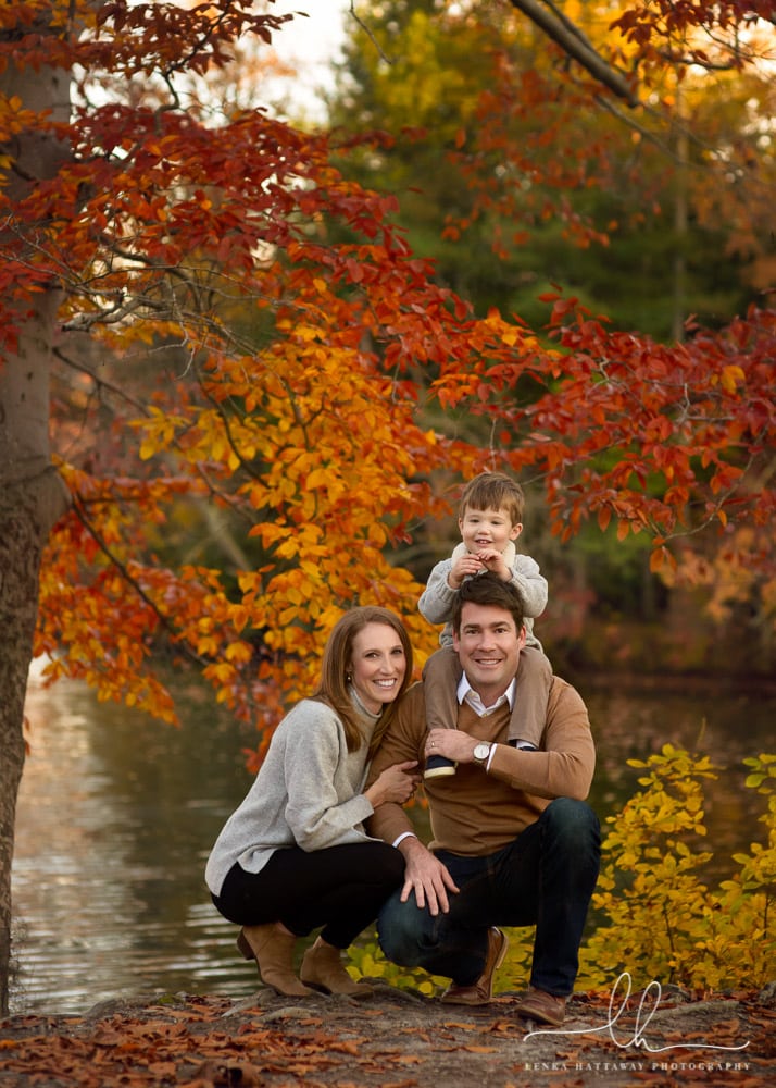 Fall family photo in Asheville, NC. Beautiful fall colors are in teh background.