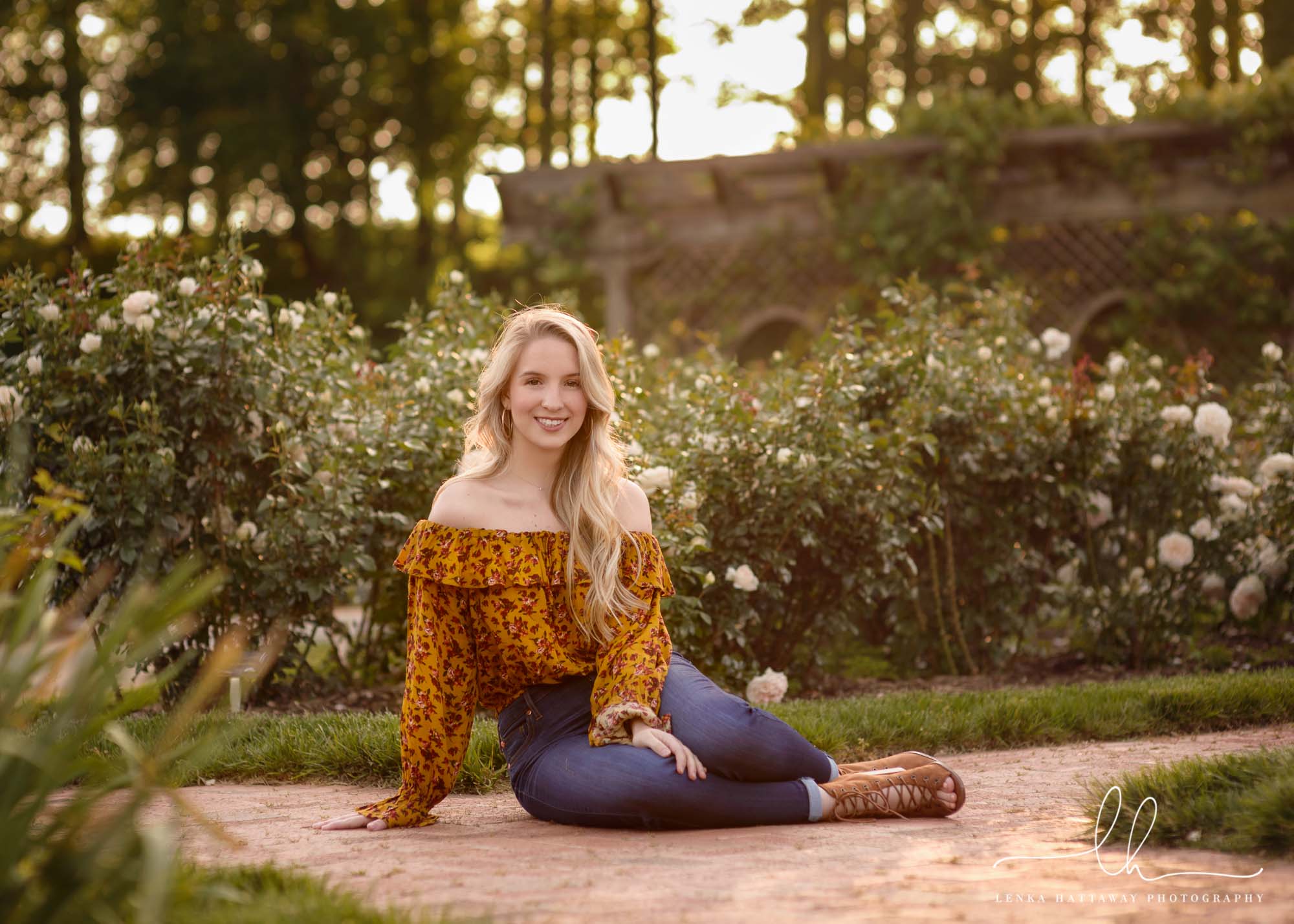 A girl in the gardens of the Biltmore during her senior photo session.