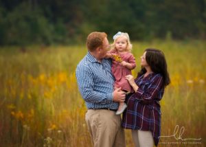 Photo of a family with mom expecting. One of 5 reasons to have maternity photos done.