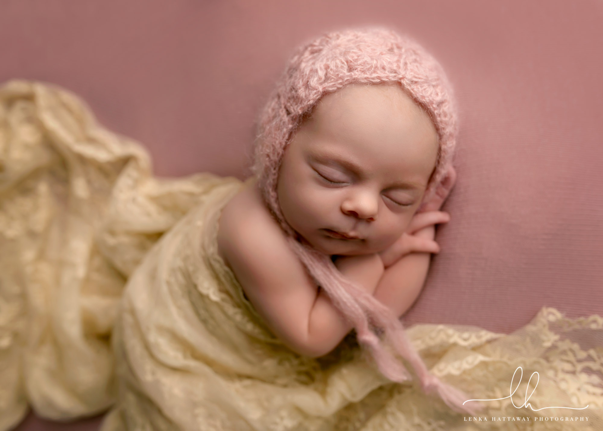 Adorable newborn photo of a sleeping baby.