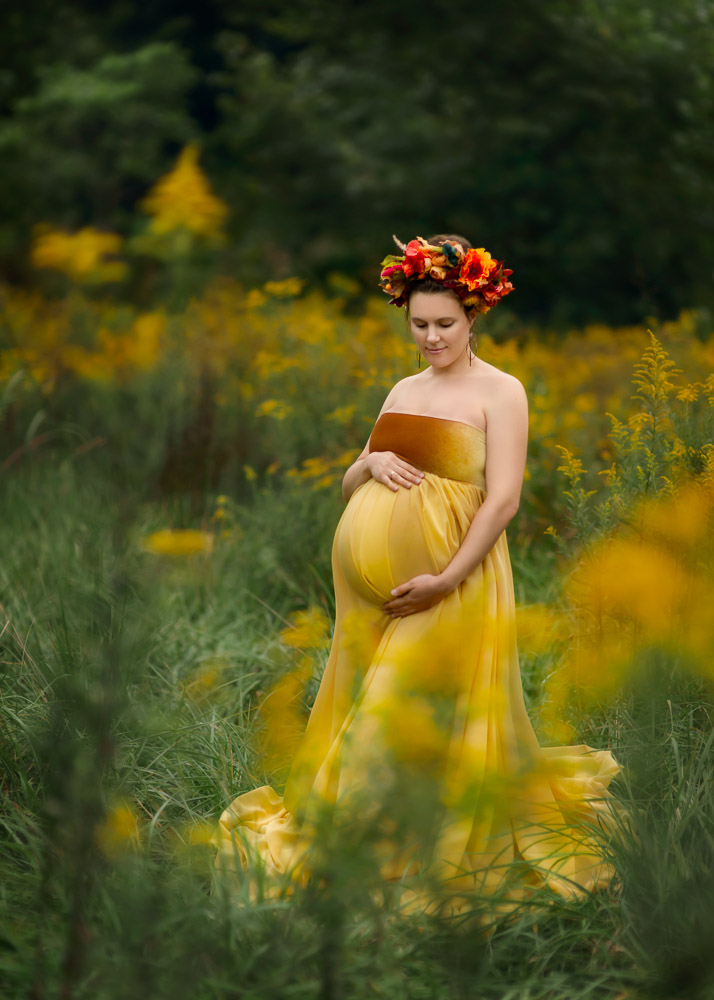 Beautiful pregnant mom in yellow dress and flower crown.