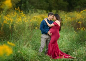 Professional maternity photo of a couple holding each other.