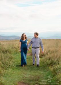 Photo of a walking couple from a maternity session in the Blue Ridge Mountains.