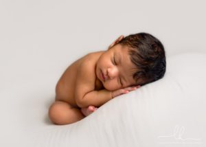 Newborn baby during an in-home newborn session.