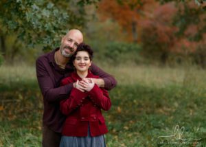 Fall photo of a father and his daughter.