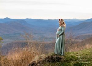 Maternity picture of a beautiful mam-to-be in the mountains.