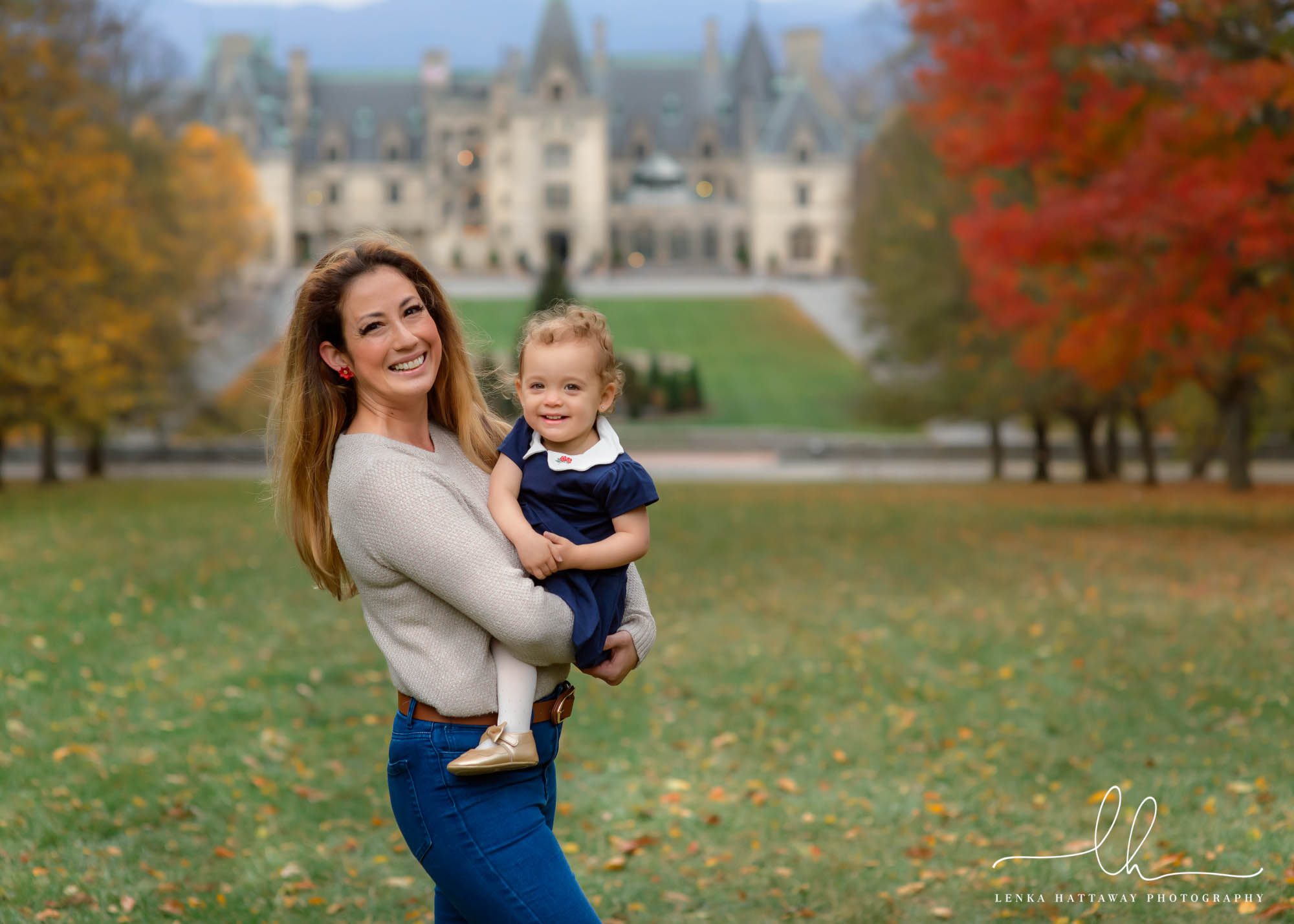 Mom with her baby girl in a photo on Biltmore Estate grounds.